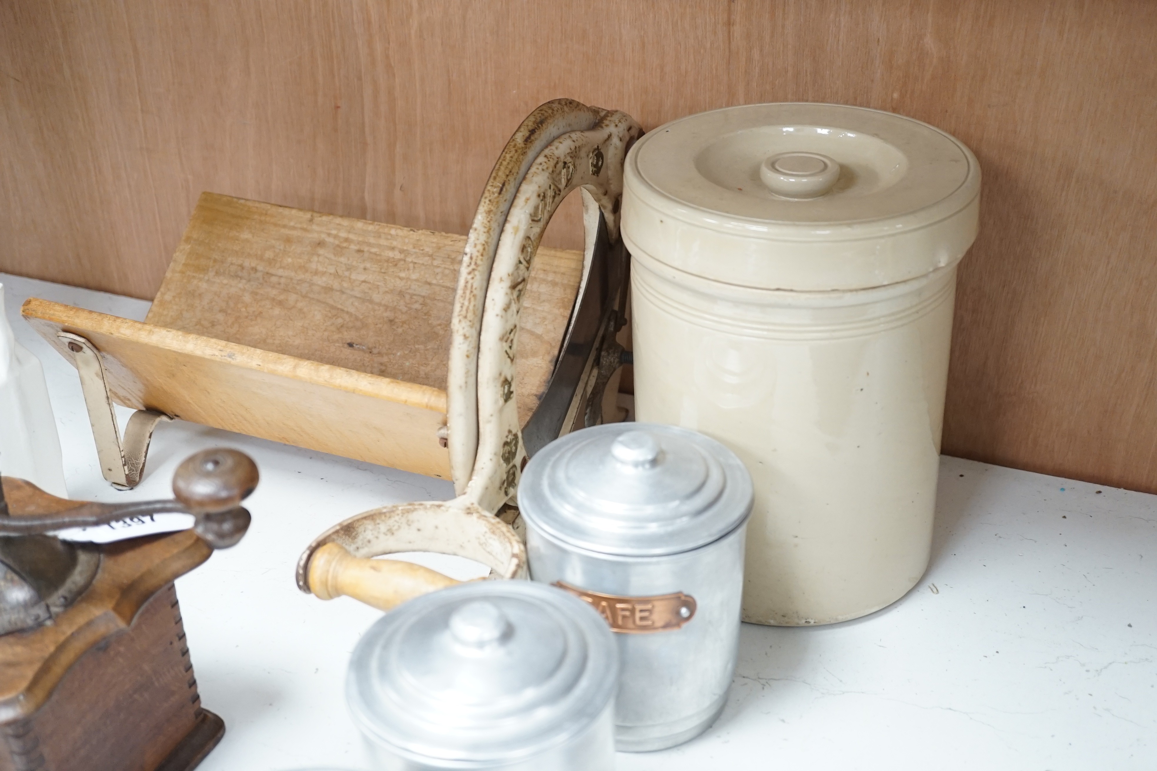 Kitchenalia: A group of French ceramic storage jars and metal canisters, a Danish bread slicer, a French coffee grinder and a croc and cover, bread slicer 31cms wide